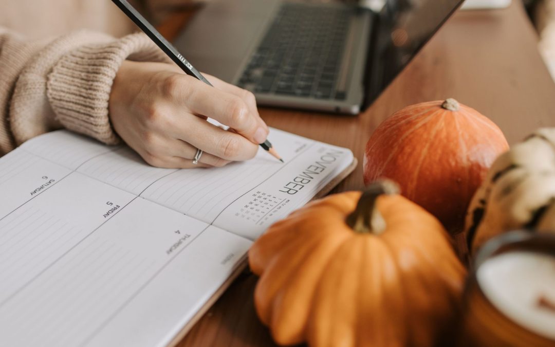 Person making notes on calendar